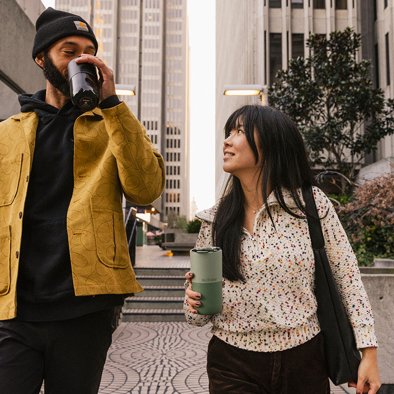 bring-your-own-party-kit-pints-and-tumblers-p3 16oz_rise_tumbler_black_iceberg_couple_drink_city_street_square.jpg