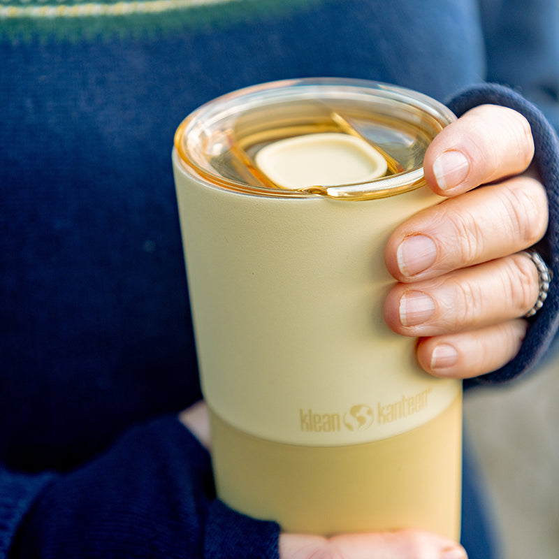 daily-on-the-go-set-q2 16oz_rise_tumbler_wax_yellow_closeup_hand_lid_square.jpg