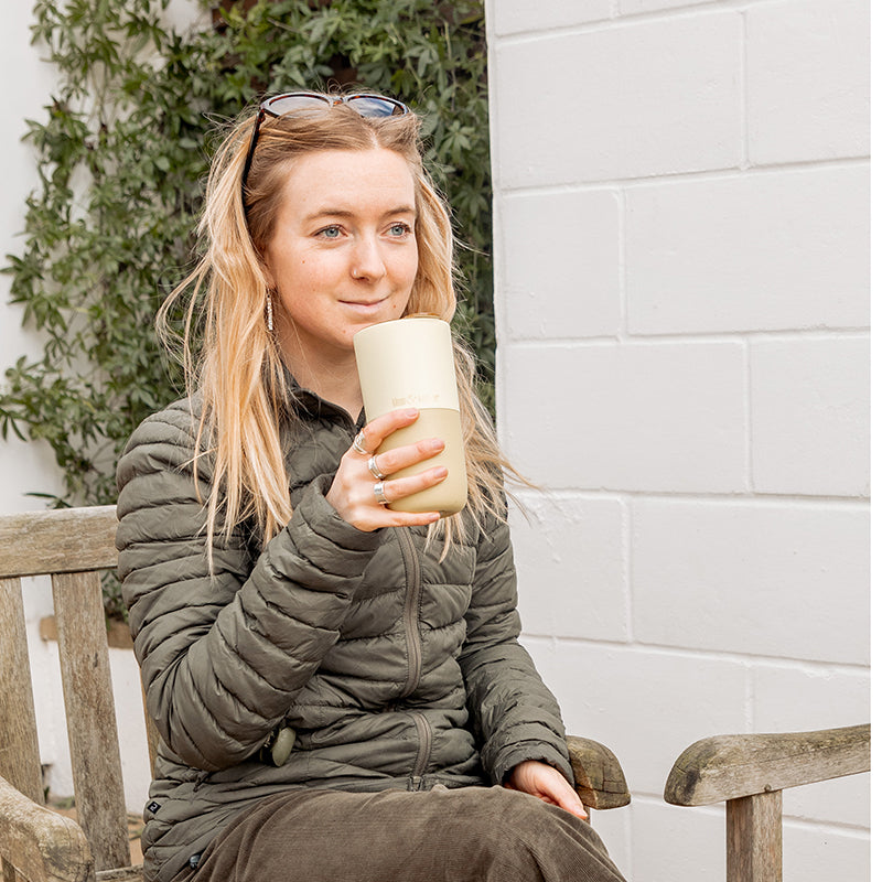 16oz-rise-tumbler-n5 16oz_rise_tumbler_wax_yellow_woman_seat_outside_square.jpg