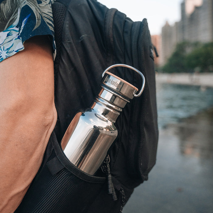 27oz-reflect-with-bamboo-cap-b5 K27SSLRF-MS-BAMBOO_reflect-bottle_backpack_lifestyle.jpg