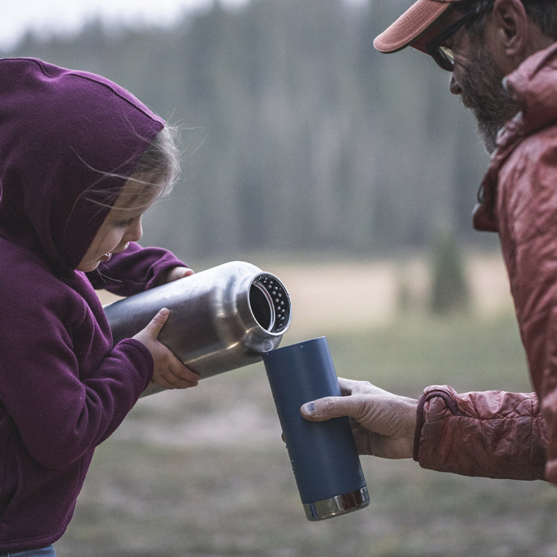64oz-tkwide-with-loop-cap-a2 tkwide_64oz_bottle_girl_dad_filling_square.jpg